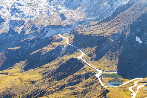 The mountain serpentine of the panoramic mountain road Grossglocknerstrasse. The Hohe Tauern Park. The slopes of the Austrian Alps are covered with colorful moss. Austria