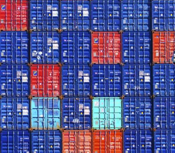 Piled up cargo containers in the Rotterdam harbor area