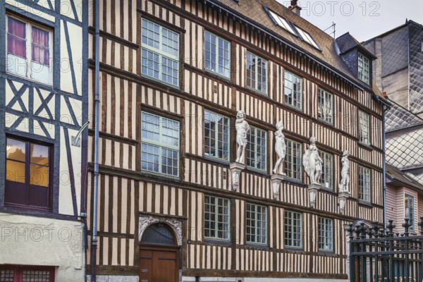 Historical half-timbered house with sculpture in Rouen, France, Europe