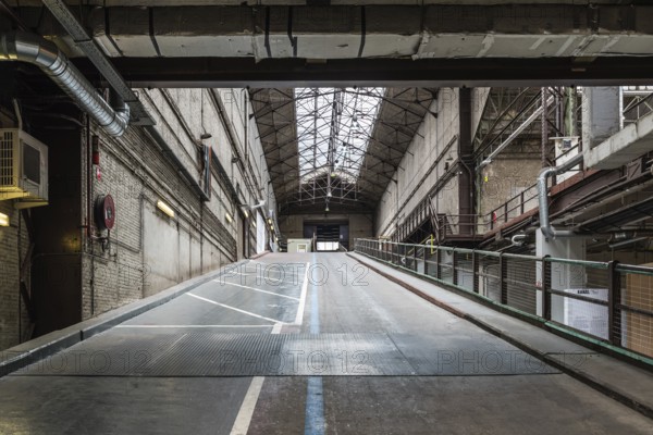 Brussels, Belgium, 05 23 2018: Industrial garage hall of the Kanal Centre Pompidou, now a museum, Europe