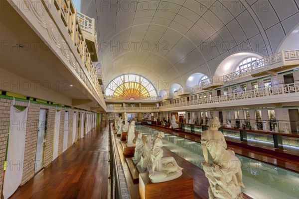 ROUBAIX, FRANCE, JUNE 14, 2024 : interiors Art Deco decors and sculptures of the olympic swimming pool La Piscine, built year 1927 by the Lille architect, Albert Baert