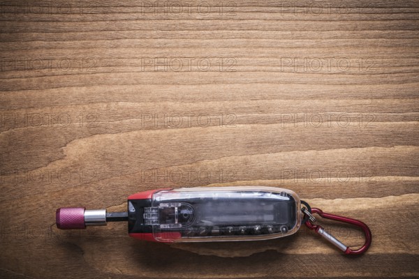 Replaceable screwdriver bits in toolbox on wooden board construction concept