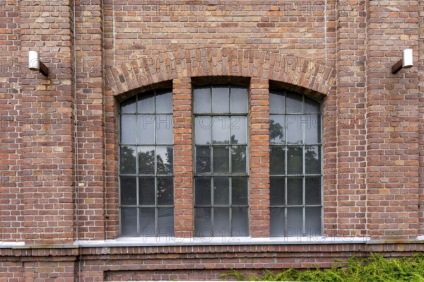 Windows of an 100 years old industrial brick building