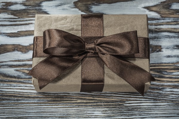 Brown present box on wooden background