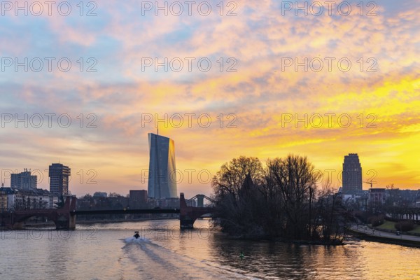 View across the Main to the ECB. Sunrise in the background of the buildings. Taken in the morning in Frankfurt am Main