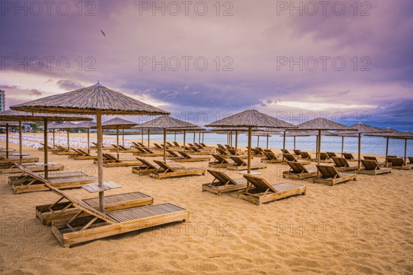 The beach has sunbeds and bamboo parasols and appears quiet and deserted when the sky is cloudy, Golden Sands, Varna, Bulgaria, Europe