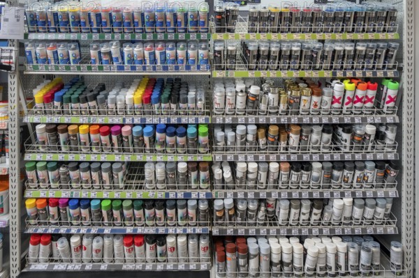 Shelf with spray paint cans in a DIY store, Allgäu, Swabia, Bavaria, Germany, Europe