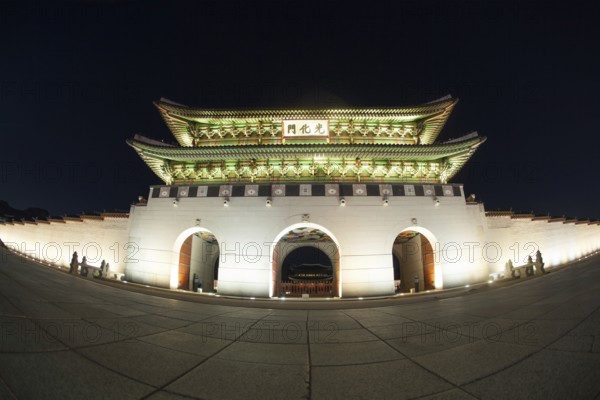 Wide angle shot of the illuminated Gwanghwamun Gate at night. Sightseeing of Seoul, South Korea, Asia