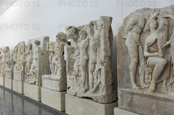 Excavation site site of the ancient city of Aphrodisias, today's city of Geyre, Karacasu, Aydin, Western Turkey, Turkey, Asia, Ancient marble sculptures and reliefs exhibited in a corridor of a museum, City of Aphrodisias, Caria, Aydin Province, Asia