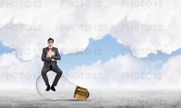 Young businessman with a book. Concept of Creativity in Business