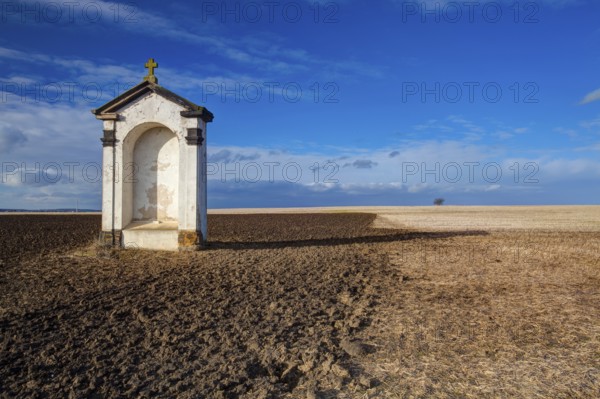 A small chapel in the middle of autumn fields