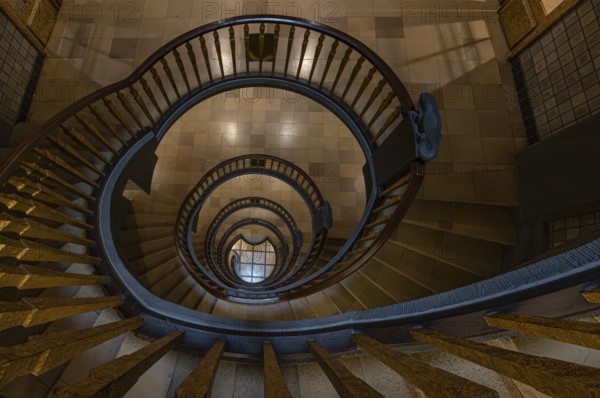 Elegant spiral staircase with wooden railing in a building, abstract view from above, Kontorhausviertel, Old Town Hamburg, Free and Hanseatic City of Hamburg, Germany, Europe