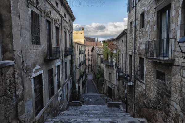 Old Town (Barri Vell) historic architecture in city of Girona in Catalonia, Spain, buildings along Sant Domenec stairs, Europe