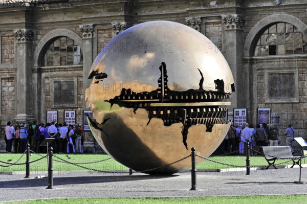Mappa Monda, Sfera con Sfera, Globe, Palazzetto del Belvedere, Cortile della Pigna, Vatican Museums, Vatican, Rome, Lazio, Italy, Metallic globe in the middle of people on a square in front of a building, Rome, Lazio, Italy, Europe