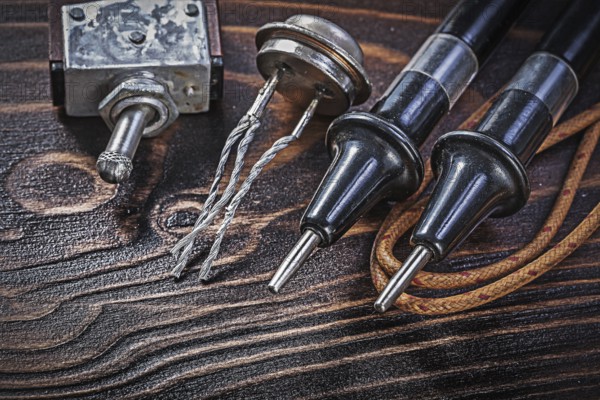 Set of vintage electric equipment on wooden board electricity concept