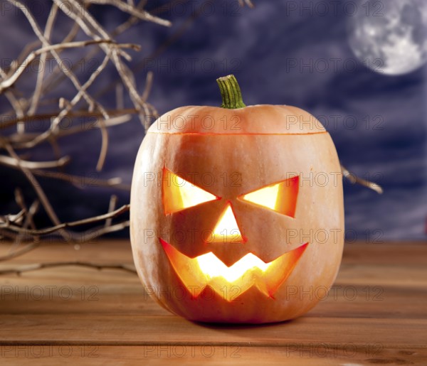 Halloween lantern pumpkin in dark sky clouds moonlight