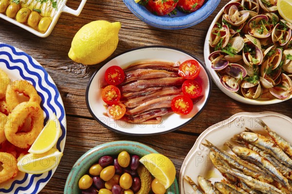 Tapas spanish seafood clams shrimps and fried anchovies fish