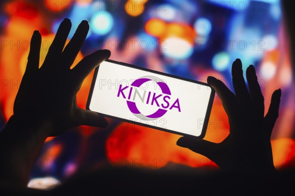 In this photo illustration, the Kiniksa Pharmaceuticals logo is displayed on a smartphone mobile
