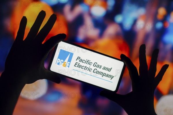 In this photo illustration, the Pacific Gas and Electric Company (PGE) logo is displayed on a smartphone mobile screen