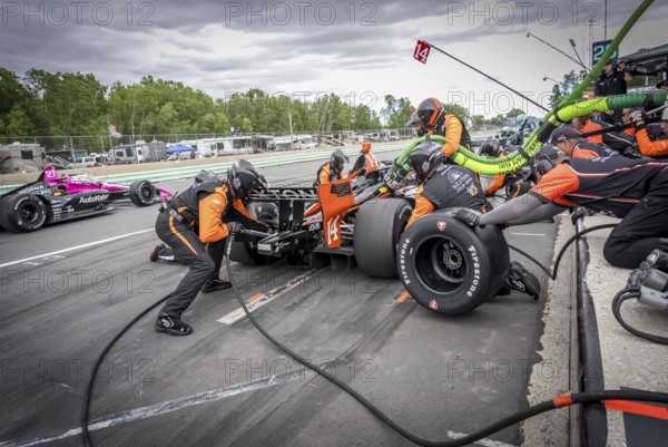 SANTINO FERRUCCI (14) of Woodbury, Connecticut comes down pit road for service during the XPEL Grand Prix at Road America in Elkhart Lake, WI