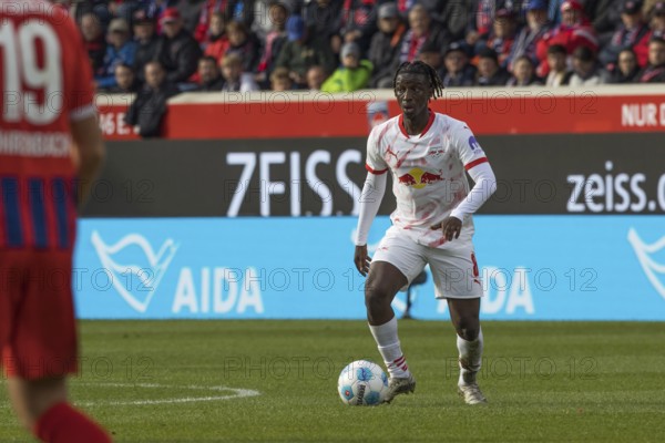 Football match, Amadou HAIDARA RB Leipzig concentrating on the ball looking to the left, Voith-Arena football stadium, Heidenheim