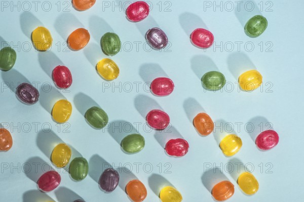 Candy scattered on the wooden table