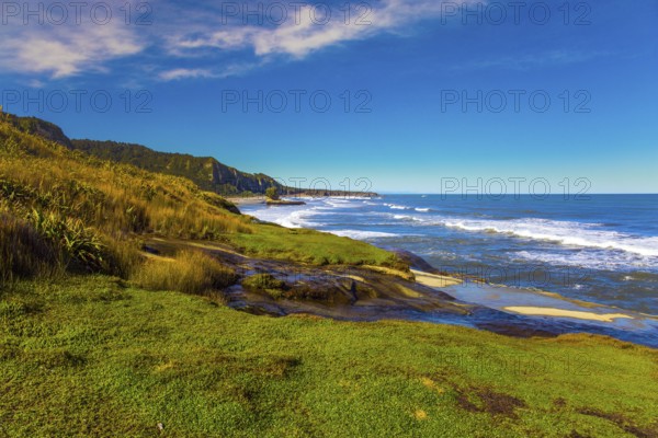 New Zealand. The picturesque Pacific coast of the South Island. Powerful ocean surf. Incredible journey to the ends of the world. The concept of ecological, active and photo tourism
