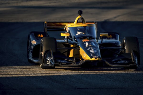 As the sun starts to set, NTT INDYCAR SERIES driver, SANTINO FERRUCCI (14) USA of Woodbury, Connecticut races through the turns during the Hy-Vee Milwaukee Mile 250's at The Milwaukee Mile in West Allis, WI, West Allis, United States of America