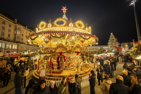 The Dresden Striezelmarkt is a Christmas market in Dresden. It has been held in Advent since 1434, usually on the Altmarkt square, and attracts an average of around two million visitors every year. It is the oldest certified Christmas market in Germany. Nostalgic merry-go-round. Dresden, Saxony, Germany, Europe