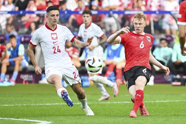 BERLIN, GERMANY - JUNE 21, 2024: Euro 2024 Groupe D match Poland vs Austria 1:3. Bartosz Slisz (L) Nicolas Seiwald (R).