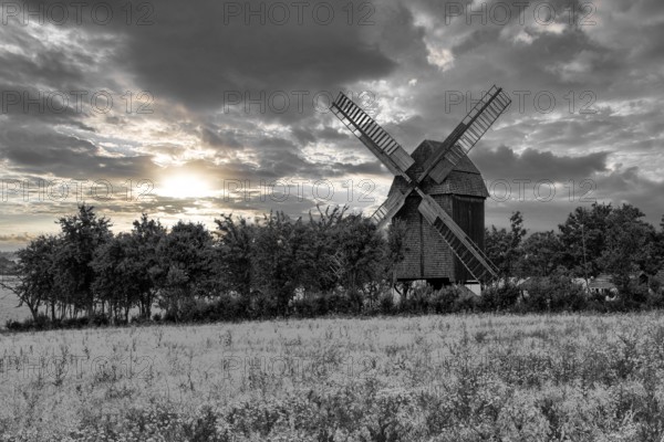 A view of a beautiful windmill in Thuringia Germany in a natural setting and an eye catcher for tourists