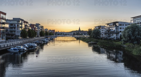 Stockholm, Sweden, 07 24 2019 -Panoramic view over the Stockholm skyline and sea with a blue pink purple sky at dusk, Europe