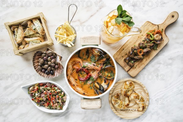 Mixed fresh seafood selection gourmet set meal on table