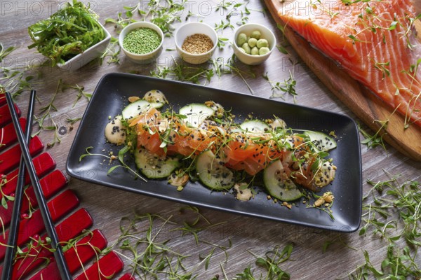 Wakame algae salad with salmon wasabi sesame and sprouts