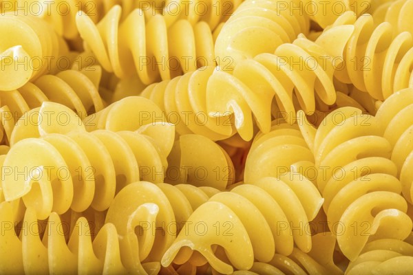 View of raw spiral pasta close up