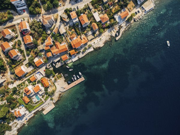 Aerial footage from the drone - villas, houses and hotels on the beach in Montenegro, the Adriatic Sea.