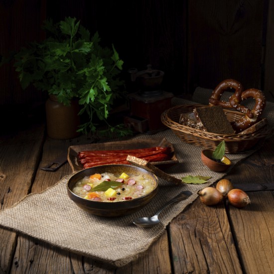 Rustic sauerkraut soup with bacon and sausage