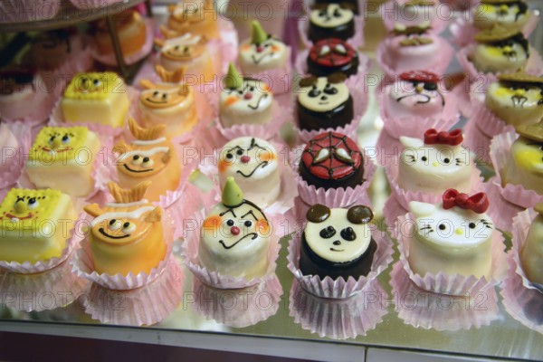 Sweet cakes of showcase of cafe in Vienna, some dessert with sugar