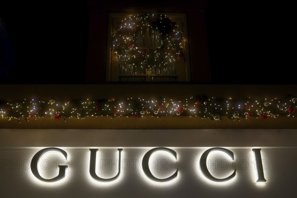 Illuminated lettering of the brand Gucci, Christmas decoration, Roermond, Netherlands