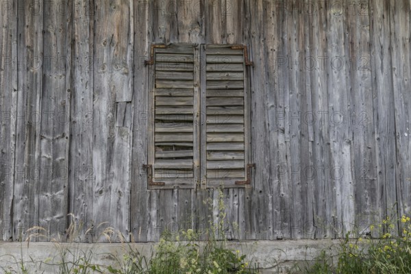 Wooden wall with closed wooden shutters from the former Brunner staff house which has since been demolished, Honau, Lucerne, Switzerland, Europe