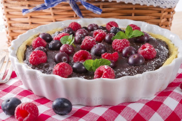 Chocolate tartelette with forest fruits
