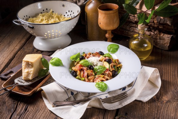 Ribbon Pasta with courgette and olives in tomato sauce