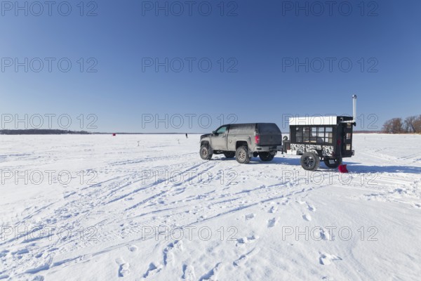 Winter, car with a heated trailer on the frozen Saint Lawrence River, Province of Quebec, Canada, North America