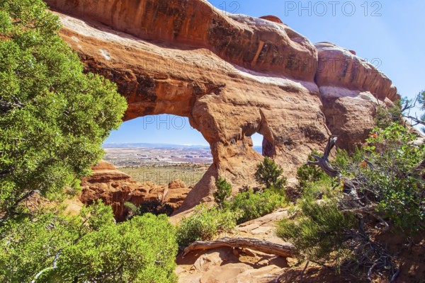 Picturesque red-brown sandstone cliffs form a unique landscape. Grandiose rock compositions natural origin. The various geological formations of Arches Park. Utah, USA, North America