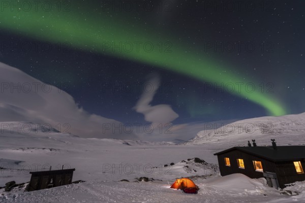 Northern Lights (Aurora borealis) over moonlit mountains on the long-distance hiking trail Kungsleden, Alesjaure, Norrbotten Lapland, Sweden, March 2013, Europe
