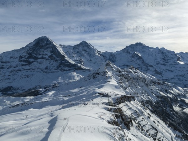 Eiger North Face and Monch Mountains in Winter. Swiss Alps. Switzerland. Aerial View