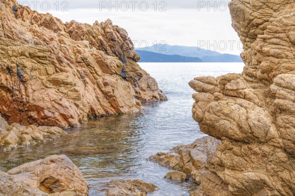 Rugged rocky coast of the Plage de Stagnoli on the Mediterranean Sea, Gulf of Sagone, west coast of Corsica, Corsica, France, Europe