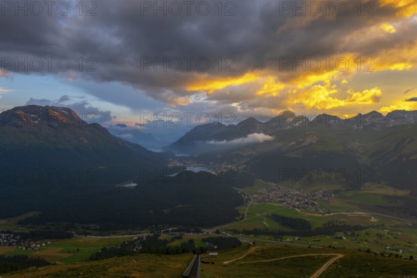 Beautiful Aerial View over Five Lakes and Swiss Alps and Cityscape in Sunset and Storm Clouds over St Moritz, Maloja, Grisons, Switzerland, Europe
