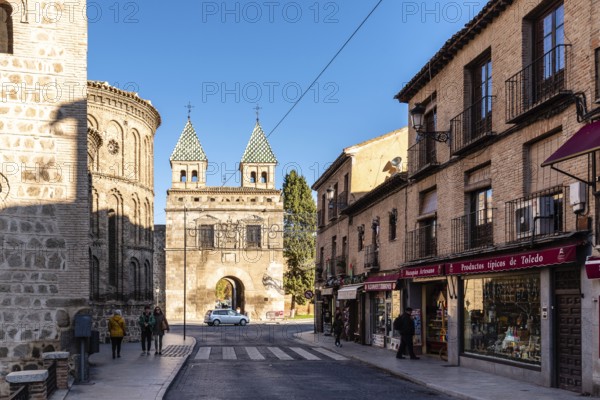 Toledo, Spain, December 6, 2019: The New Bisagra Gate and Santiago del Arrabal church. Real del Arrabal street, Europe