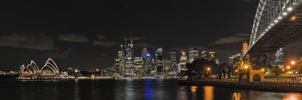 Sydney Opera House at night from Milsons Point and with skyline in the background. Reupload after color correction